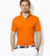 A classic short-sleeved polo shirt is cut for a relaxed, comfortable fit in smooth, soft cotton interlock.