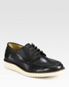 Lace-up style of rich leather with contrasting vibram sole.Leather upperLeather liningPadded insoleVibram soleImported