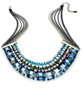 Walk proud in this necklace from c.A.K.e. by Ali Khan. Crafted from silver-tone and hematite-tone mixed metal, the necklace shimmers brightly with multicolor glass cubes for a bit of animal magnetism. Approximate length: 18 inches + 3-inch extender. Approximate drop: 1-1/4 inches.