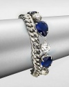 From the Black Tie Optional Collection. A chunky curb chain is joined by a row of sapphire blue and clear faceted stones in this fun design, the two strands creating a quirky complement to one another.Glass and plasticSilvertoneLength, about 8Ring claspImported