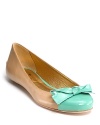 Glossy color jazzes up the Tabby flats from Kate Spade, finished with a charming, bow-adorned cap toe.