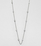 From the Soho Collection. A delicate sterling silver link chain accented with bezel set white sapphire stations. Sterling silverWhite sapphiresLength, about 36Slip on styleImported 