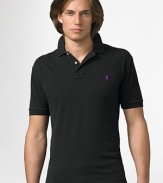 The custom fit cotton mesh polo is cut slimmer and shorter than the original. It is finished with a two-button placket, banded sleeves, uneven vented hem and an embroidered pony. Machine wash Imported