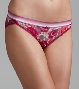 A floral print in rich autumn colors decorate a stretchy bikini from Calvin Klein.