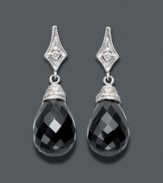 The perfect complement to your little black dress -- these divine drops will create a dramatic effect. Set in 14k white gold, a round-cut diamond (1/3 ct. t.w.) shines against the backdrop of faceted onyx (14 mm x 10 mm). Approximate drop: 1 inch.