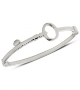 Unlock your new look with this bangle bracelet from Fossil. Features a bent key accent with clasp closure. Crafted in polished stainless steel. Approximate diameter: 2 5/8 inch.