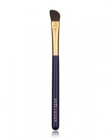 Angled brush sweeps on powder eyeshadow for allover base application plus definition on the outer lid and crease.