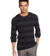 Bold horizontal stripe sweater by Calvin Klein with silhouettes of multi-circles on each stripe makes it a style standout.