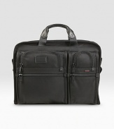 A slim, organized brief case for large screen laptops (up to 17). Separate cushioned laptop compartment Removable accessory pouch Interior pockets and elastic organizer panel Carry handles and removable, adjustable shoulder strap Add-a-bag sleeve for attaching to other cases Tumi Tracer Protection Ballistic nylon 13½H X 17½W X 3½D Imported