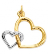 Double your affection. This cute cut-out double heart charm is crafted in polished 14k gold and sterling silver. Chain not included. Approximate length: 7/10 inch. Approximate width: 3/5 inch.