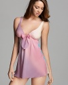 A whimsical ombré rainbow babydoll with large bow detail at front.