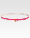 How charming, this skinny belt offers a pop of on-trend, neon color and a unique, charmed buckle closure.About .5 widePVCCharm on buckle closureImported