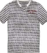 A v neck and stripes on this Guess t shirt add a nautical touch that really makes a style statement.