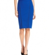 Look sharp! Alfani's faux leather-trimmed pencil skirt instantly adds modern polish to your wardrobe.