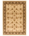 Taking its namesake from the original Kashan rugs of Persia, this area rug displays a regal look with intricate medallions in a light gold, cream, black colorway with hints of crimson. Made in the USA of lush, heat-set polypropylene for sheer durability and effortless style.