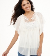 Style&co.'s tunic gets a springtime makeover with a romantic sheer fabric and a delicate, rhinestone-trimmed crochet bib!