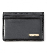 Wrought in quality burnished leather, this slim credit card case features a logo plaque on the front, clear ID holder and 2 exterior credit card slots.