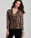 Follow your animal instincts in this cheetah print top by Jones New York Collection. Refined front pleat detail and an empire waist create a flattering silhouette.