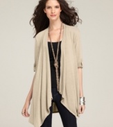 A swingy cardigan gets a new look from Style&co. The elbow-length sleeves look chic with button-closure roll tabs!