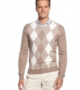 Traditional argyle golf sweater by Greg Norman for Tasso Elba Golf will keep you warm during early tee times.