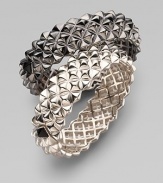 Fabulously crafted bangle of blackened sterling silver displays a sculptural stud pattern with one contrasting stud at the clasp. Sterling silver Diameter, about 2½ Width, about ¾ Hinged with clasp Imported Please note: Bracelets sold separately.