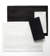 Made for celebration, the Cheers Twist napkin by Mikasa sets the scene with an understated linear pattern and dressy sheen in versatile black or white. Machine washable table linens make for an especially happy host, too.