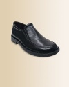 A swanky set of dress shoes in smooth leather with an elastic panel to make slipping them on and off a breeze.Pull-on styleLeather upperLeather liningRubber solePadded insoleNike Air technologyImported