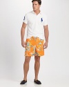 Designed for a relaxed fit, the East Hampton swim trunk is rendered in soft, quick-drying nylon with a bold tropical print.Shoestring waistVelcro® flySide slash pocketsFlap patch pocket on right legPolyester liningInseam, about 7NylonMachine washImported