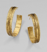 Richly textured with an organic look, these golden hoops have the sculptural appearance of wrapped and tied threads.GoldplatedDiameter, about 2Post backMade in France