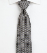 A distinguished silk tie with an irresistible print.SilkDry cleanMade in Italy