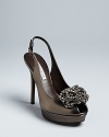 These always-elegant Vera Wang Lavender Label platform pumps feature stand-out, beaded details atop modest peep toes.