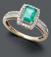 The perfect gift for a May birthday - this dazzling ring features a vibrant emerald gemstone (9/10 ct. t.w.) surrounded by rows of sparkling round-cut diamonds (1/5 ct. t.w.). Set in 14k gold.