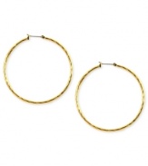 Embellished elegance. Anne Klein adds glass accents to these hoop earrings crafted from gold-tone mixed metal to stunning effect. Approximate diameter: 2 inches.