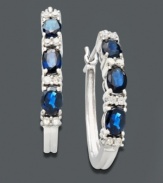 Hoop earrings with an extra splash of color. Crafted in polished 14k white gold, earrings feature alternating oval-cut sapphire gemstones (1-1/3 ct. t.w.) and round-cut diamonds (1/8 ct. t.w.). Approximate size: 1-1/2 inches x 2 inches.