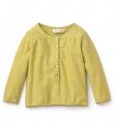 A cheerful yellow henley sweater by Pearls & Popcorn is a vibrant addition to basic jeans or leggings,