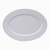 Modern in design with a raised circular pattern, made from French Limoges Porcelain. Dishwasher and microwave safe.