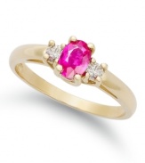 Pretty and petite. This beautiful three-stone ring features an oval-cut ruby (1/2 ct. t.w.) with two round-cut diamonds at the sides (1/8 ct. t.w.). Set in 14k gold.