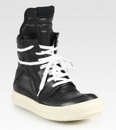 Lace-up leather high top design has a side zipper, unexpected wrap-around laces and subtle perforations at the toe. Rubber platform, 1 (25mm)Leather upperSide zipperLeather liningRubber solePadded insoleMade in ItalyOUR FIT MODEL RECOMMENDS ordering one half size up as this style runs small. 