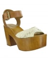 Mia's Weaver sandals have a chunky wooden platform heel that is at once retro and fashion-forward.