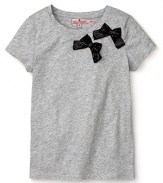 Take her t-shirts uptown with this charming Juicy Couture tee adorned with two sweet bows.