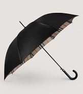 Stay warm, dry and stylish with a check-lined Burberry umbrella.