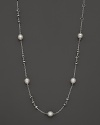 This sterling silver necklace, gleaming with freshwater pearls, makes an elegant statement. By Di MODOLO.