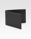 EXCLUSIVELY OURS. An everyday essential in a slightly slimmer design crafted of rich, pebbled leather.One bill compartmentFour credit card slots4¼ X 3Imported