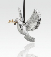 A silver dove, wings gracefully spread in flight, delivers a golden olive branch and warm holiday wishes in this delightful little sculpture.HandmadeSilverplated, goldplated and oxidizedAbout 4H X 4W X 4DImported