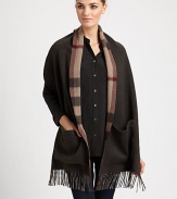 Reverses from solid to a bold check pattern with fringe trim on luxurious cashmere.Cashmere74 X 15Dry cleanImported