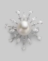 A shiny starburst with lustrous pearl center radiates with glimmering rhinestone rays. 14mm round white pearl Cubic zirconia Sterling silver Diameter, about 1½ Pin backing Made in Spain 