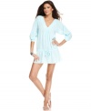 Cover up in style with J Valdi's cotton gauze tunic. The drawstring peplum hem adds a feminine touch!