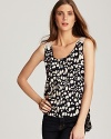 Turn around in this dot-print Vintage Havana tank to reveal a bohemian-chic crochet back.