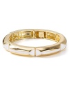 Channel this season's flair for the exotic with bold accessories like this 14-karat gold and enamel bangle from Belle Noel. Stacked or solo, this piece makes a statement.