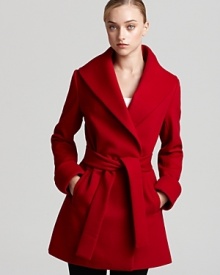 A belted Trina Trina coat, cut in a double-breasted silhouette, takes your through your schedule with sophistication--smart for the office and sharp for off-hour events.